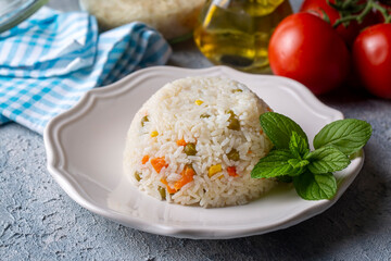 Delicious vegetable rice pilaf with green peas, carrots and sweet corn