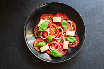 tomato salad veggie vegetable basil diet on the table summer healthy food diet meal snack copy space food background rustic. top view vegan or vegetarian food