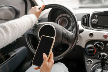 Woman use mobile phone in personal auto