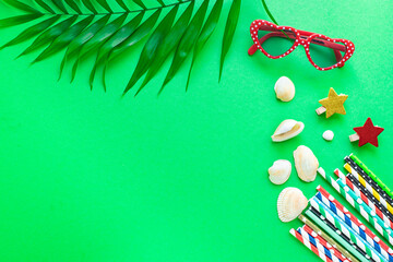 summer background mood, tropical leaf, sun glasses, seashells, accessories travel vacation, ocean sea summer toy positive mood top view