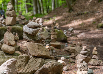 stacked stones in a forest at a hiking trail