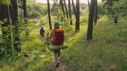 Family hiking through a forest