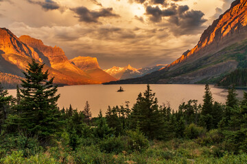 dramatic summer  sunrise in the Wild Goose Island in St. Mary's Lake in Glacier national Park in...