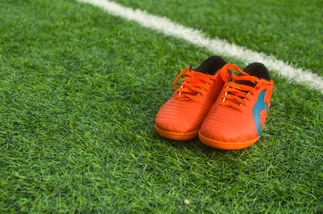 Pair Of Soccer Shoes On grass field