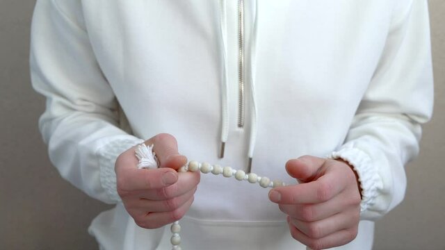 Meditation on the beads close-up. Gapa meditation on the rosary.