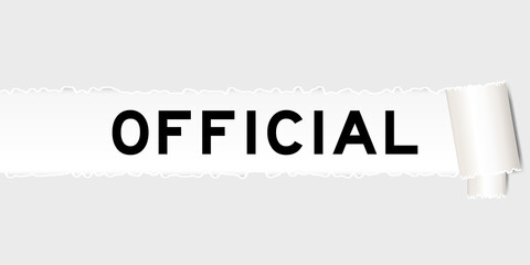 Ripped gray paper that have word official under torned part