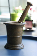 Ancient metal mortar and pestle for grinding spices
