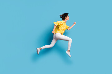 Fototapeta na wymiar Full size profile side photo of dreamy charming girl jump up air runner empty space isolated on pastel blue color background