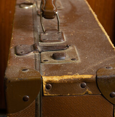 An old leather suitcase with traces of time on it 