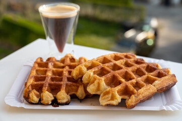 Belgian sugar waffles with black coffee served outdoor