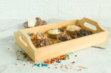 Martabak Manis is Indonesia dessert. Sweet Martabak with chocolate, cheese, peanut. this picture in white background and blurry, selective object.