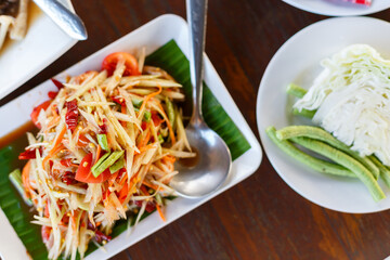 Green papaya salad thai food style .