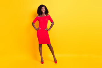 Fototapeta na wymiar Full size photo of young happy excited smiling afro girl look copyspace wear red dress isolated on yellow color background