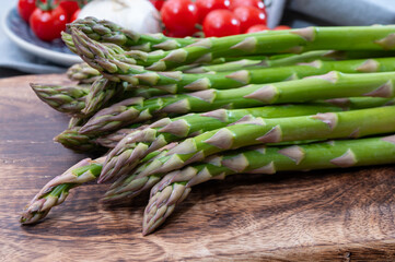 Bunch of fresh ripe green asparagus vegetables ready to cook or grill