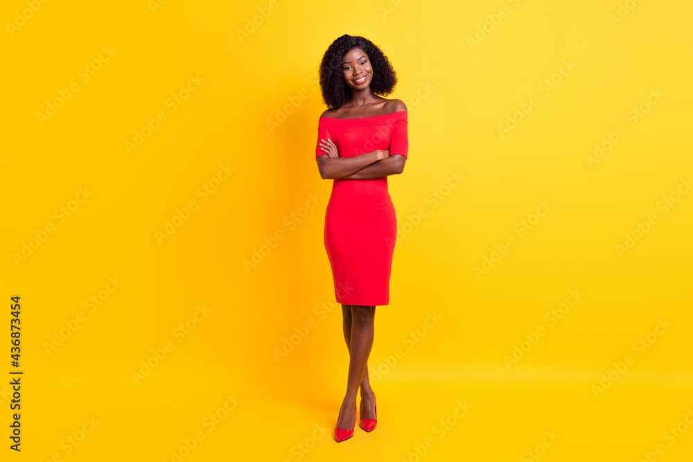 Wall mural Full size photo of young happy positive gorgeous stunning afro girl with folded hands isolated on yellow color background