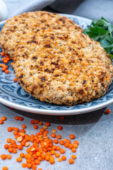 Healthy vegetarian or vegan food, meat free burger made from orange lentils legumes