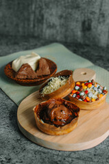 Martabak Manis is Indonesia dessert. Sweet Martabak with chocolate, cheese, peanut. this picture in white background and blurry, selective object.