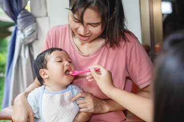 Feeding a baby for the first time with solid food