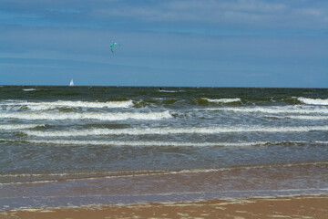 Watersport on yellow sandy beach in small Belgian town Knokke-Heist, luxury vacation destination, summer holidays