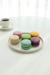 Sweet colorful macarons isolated on white background.