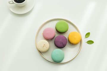 Sweet colorful macarons isolated on white background.