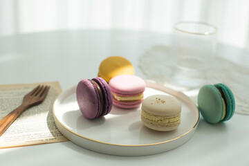 Sweet colorful macarons isolated on white background.