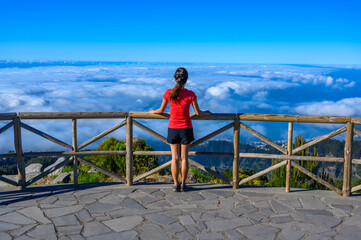 Hiker in Madeira Island - View Point of mountain scenery of the highland - tabove the clouds -...