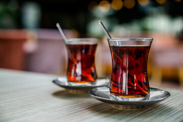 Turkish tea in national glass tea cups. - obrazy, fototapety, plakaty