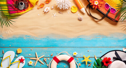 Beach Accessories On Tropical Sand And Wooden Table