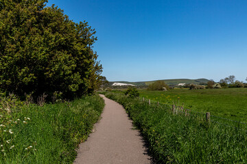 Fototapeta na wymiar Looking along a footpath through the countryside, near Lewes in Sussex