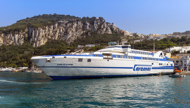 Capri, Italy - August 2019 2019: Wide angle view of a large fast ferry docked in the port on the Isle of Capri.