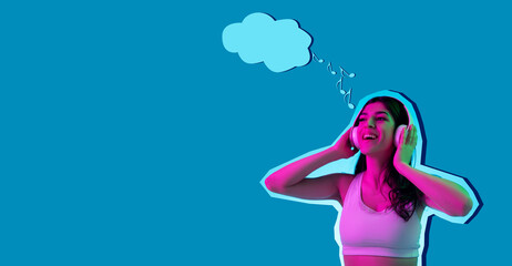 Young beautiful girl listening to music isolated over blue background in neon light. Concept of beauty, fashion,ad. Flyer