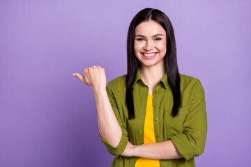 Photo of dreamy sweet young woman wear khaki outfit smiling pointing thumb up empty space isolated violet color background