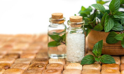 Spa and wellness setting with sea salt, oil essence, jasmin flow