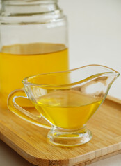 Freshly made liquid homemade ghee butter oil. Healthy food concept. Ayurveda product