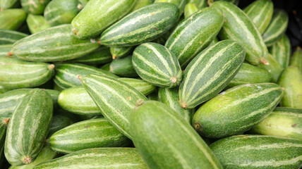 Street vendor selling green pointed gourd at street of Dhaka, Bangladesh