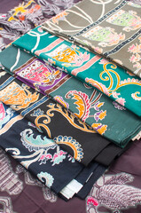 Batik is the art of painting cloth using wax and natural or artificial coloring. Close up colorful and beautiful batik fabric. Javanese batik. Indonesian batik.