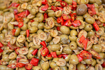 Salting olives sold on outdoor market, Sicily, Italy
