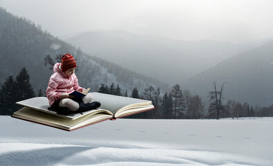 Little girl reading a book