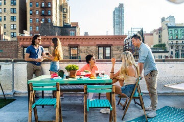 Group of friends having party on a rooftop