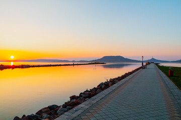 Beautiful panorama of Lake Balaton near the town of Fonyod, in the background the Badacsony Mountains and Szigliget at sunset - 436883672