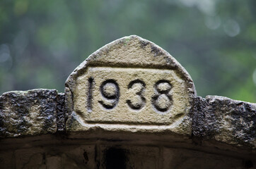 Closeup shot of numbers on weathered stone outdoors