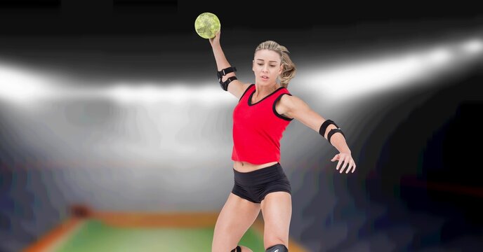 Composition of female volleyball player jumping throwing ball over blurred indoor court background