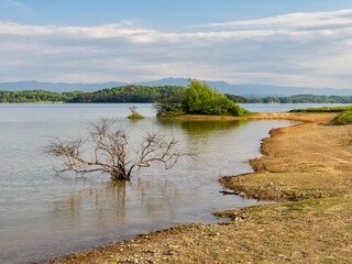 Douglas Lake in the spring in Tennessee with the Great Smoky Mountains in the background, the water...