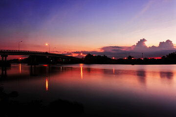 Fototapeta premium The evening sun is on the bridge over the river and the sky beautifully.