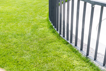 grating wire industrial fence panels, pvc metal fence panel and neatly trimmed lawn.