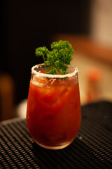 salty cocktail made with tomatoes pepper and brussel sprouts for ornamentation