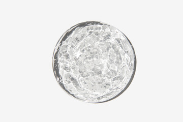 Close-up transparent cosmetic gel in glass isolated on white background. Make-up and cosmetics...