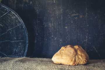A rosetta f bread on wooden background in dark tone