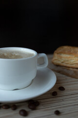 coffee and pastries close-up on a wooden table